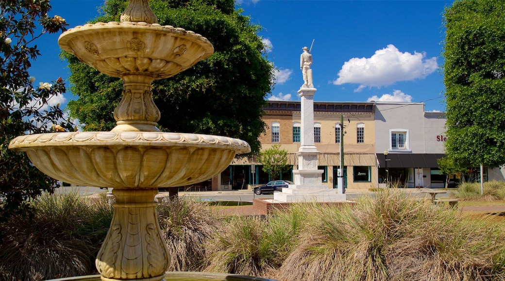 Waycross featuring a fountain and a statue or sculpture
