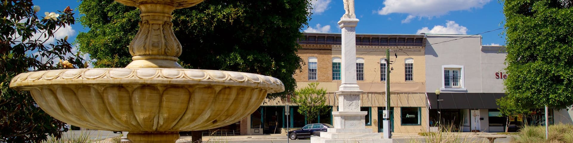 Waycross featuring a fountain and a statue or sculpture
