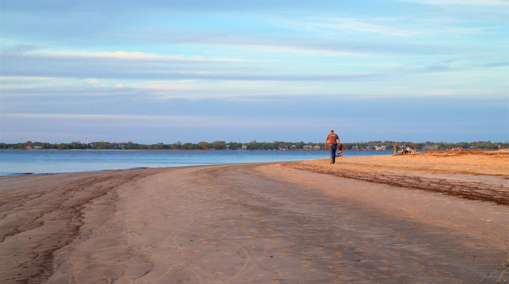 Driftwood Beach showing a sandy beach, general coastal views and a sunset