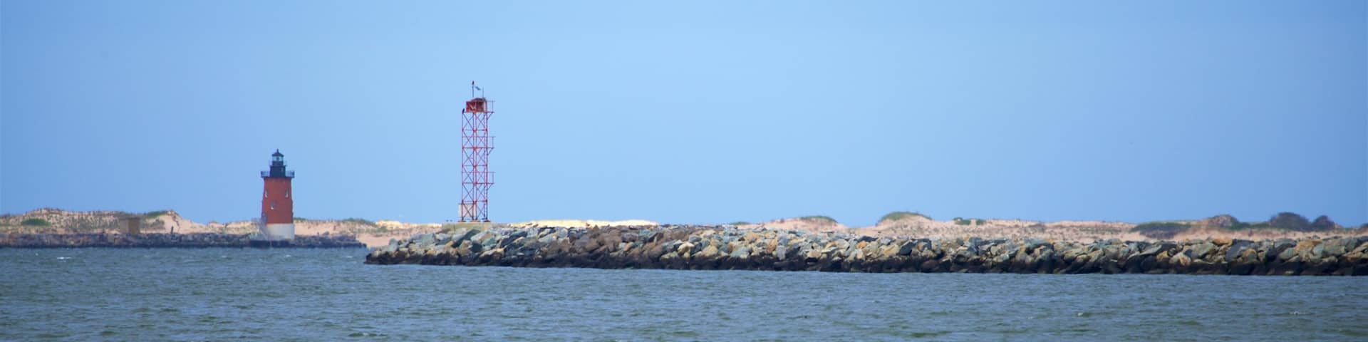 Lewes Beach featuring a lighthouse, general coastal views and a beach