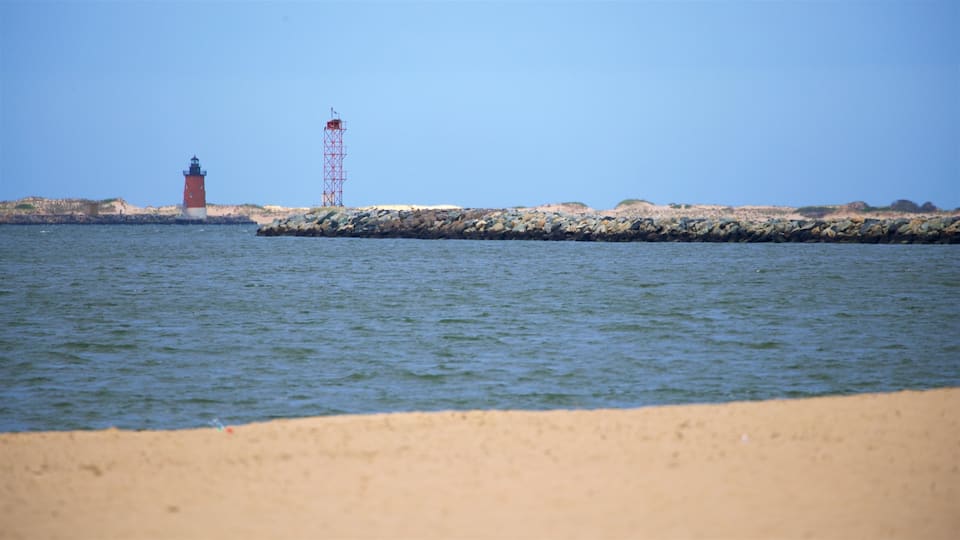 Lewes Beach which includes a sandy beach, a lighthouse and general coastal views