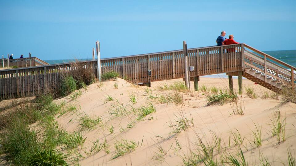 Bethany Beach showing general coastal views and a sandy beach as well as a couple