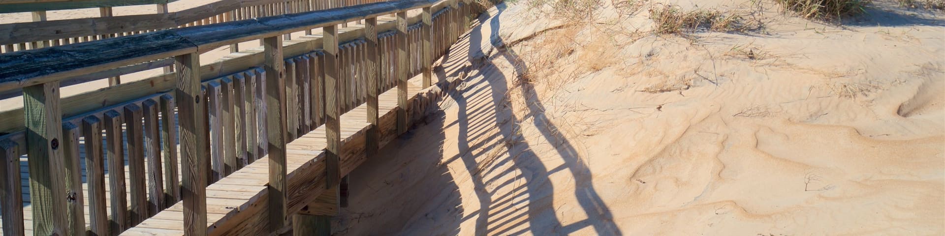 Fenwick Island State Park which includes a sandy beach and general coastal views