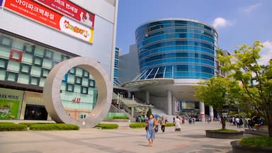 Seoul featuring a city and modern architecture as well as a small group of people