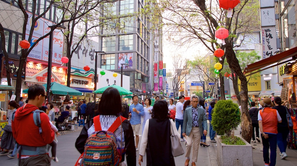 Insadong showing shopping and a city as well as a small group of people