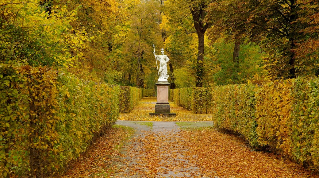 Schloss Charlottenburg featuring a garden, a statue or sculpture and autumn colours