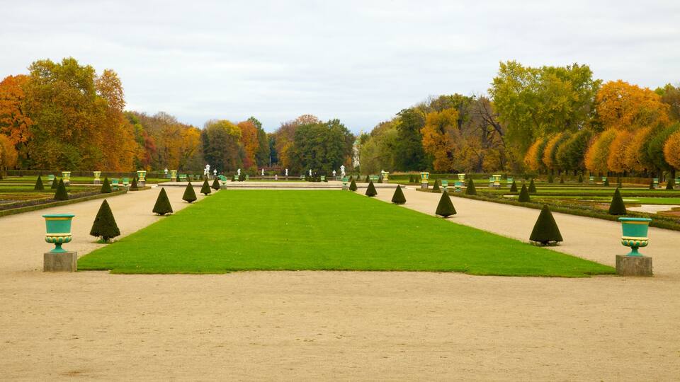 Exploring the beautiful gardens of Schloss Charlottenburg in Berlin during autumn with vibrant foliage and manicured landscapes