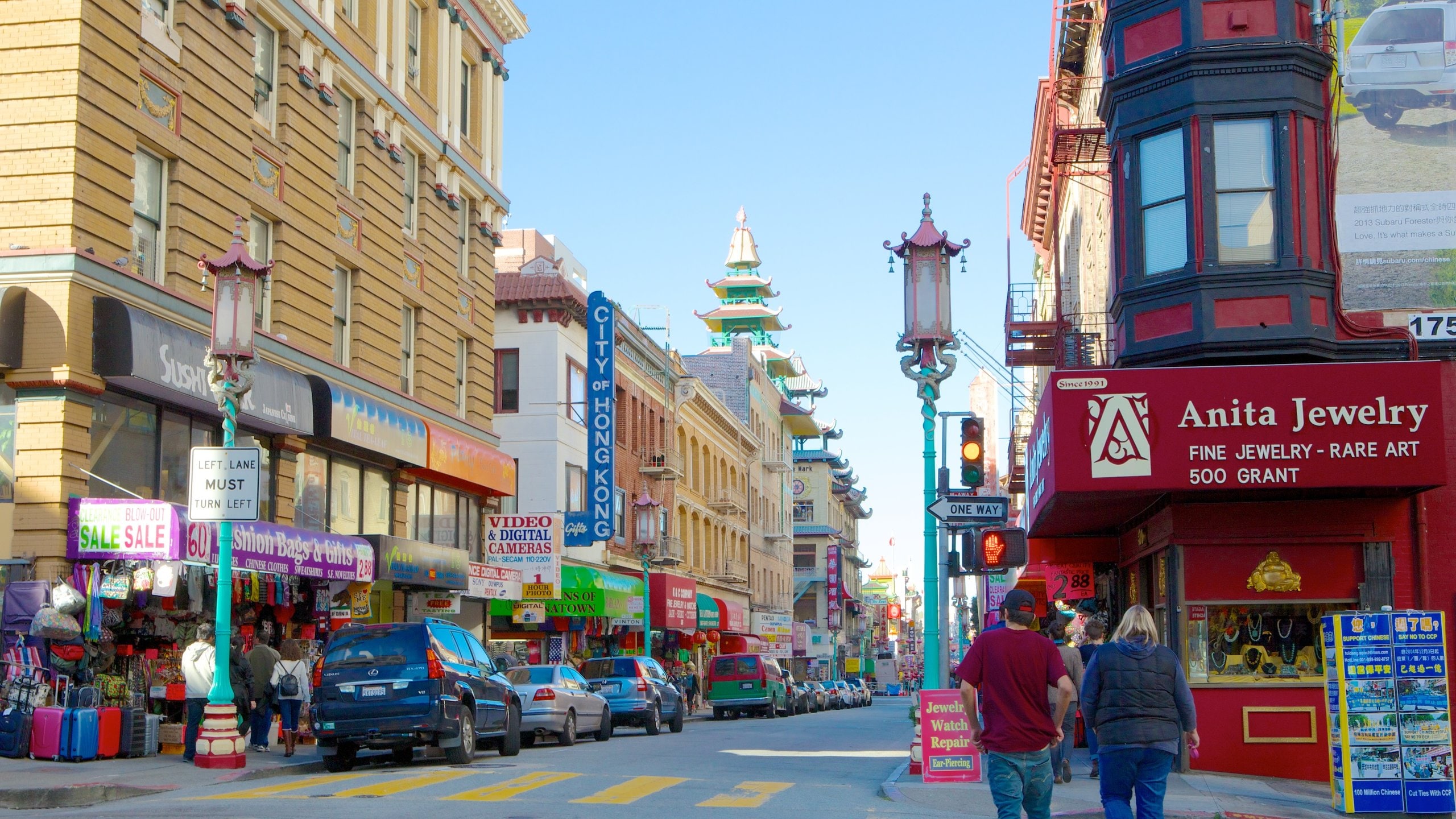 Chinatown showing a city and street scenes as well as a couple