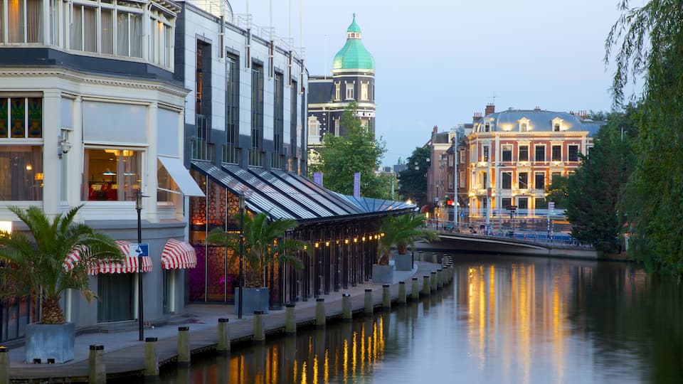 Amsterdam showing a city, street scenes and a river or creek