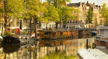 Amsterdam showing a city, a river or creek and boating