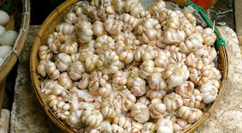 Market display of fresh garlic in Phnom Penh, Cambodia, showcasing vibrant local produce and culinary staples
