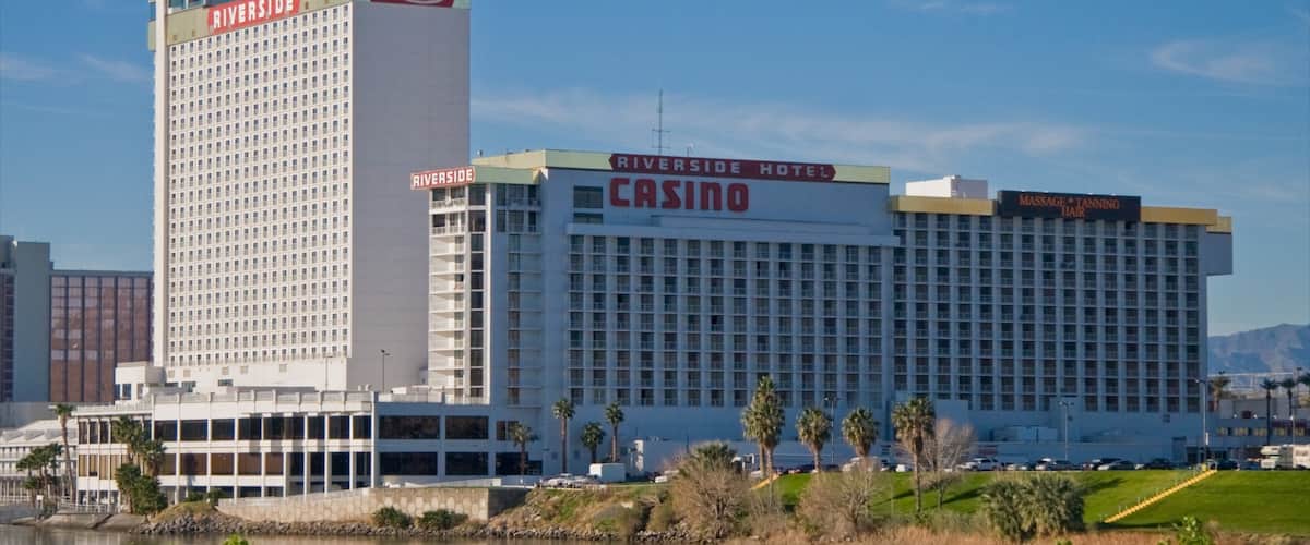 Laughlin showing cbd, a river or creek and signage