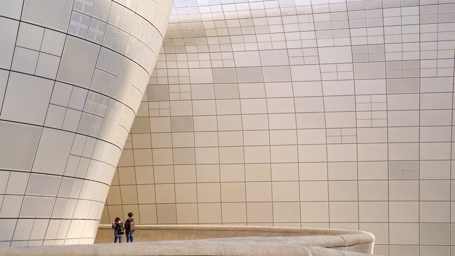 Dongdaemun Design Plaza featuring modern architecture as well as a couple