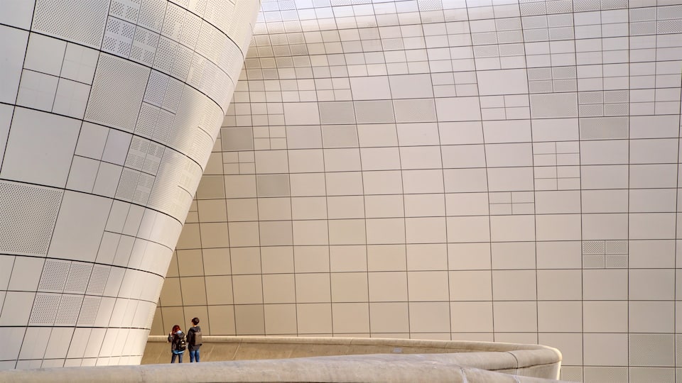 Dongdaemun Design Plaza featuring modern architecture as well as a couple