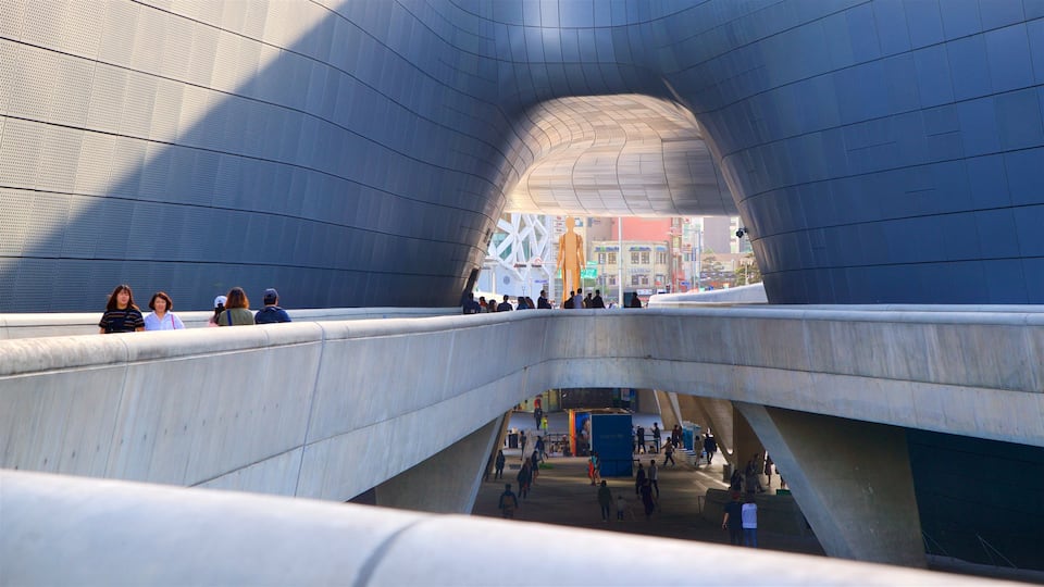 Dongdaemun Design Plaza showing interior views and modern architecture as well as a small group of people