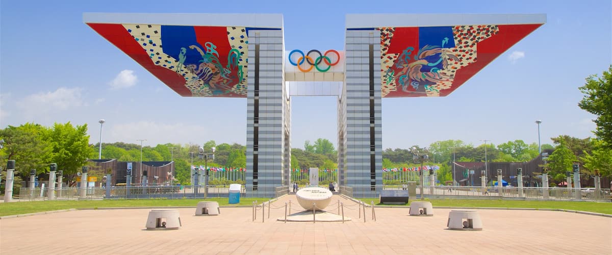 Olympic Park showing signage, heritage elements and a garden