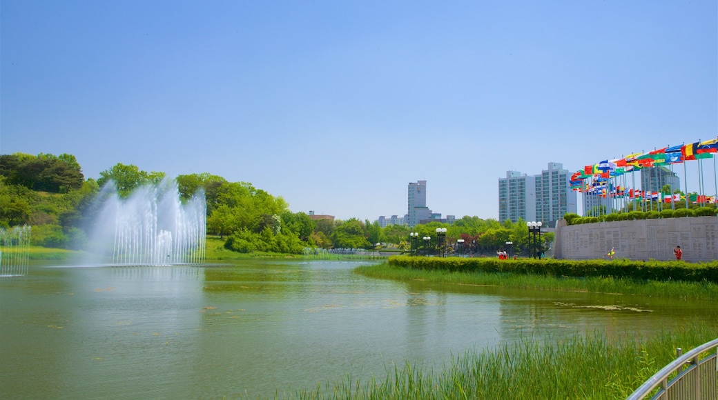 Olympic Park which includes a river or creek, a city and a fountain