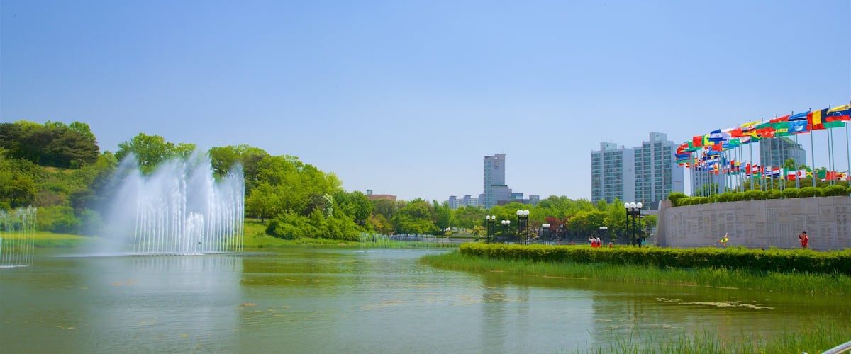 Olympic Park which includes a river or creek, a city and a fountain