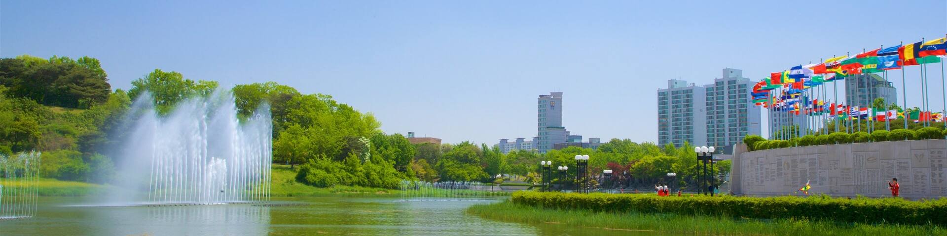 Olympic Park, Seoul, South Korea featuring a fountain, a river or creek and a city