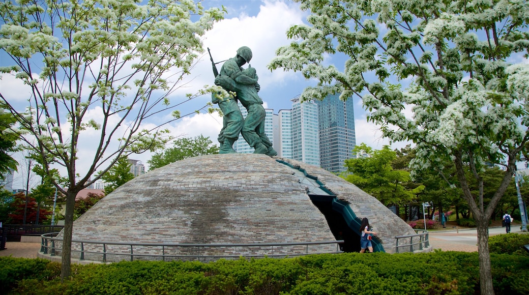 War Memorial of Korea featuring a garden, a city and a statue or sculpture