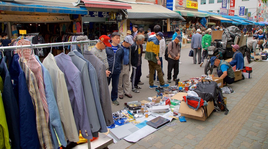 Gwangjang Traditional Market featuring markets as well as a small group of people