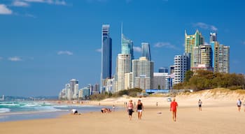 Main Beach which includes a skyscraper, general coastal views and a beach