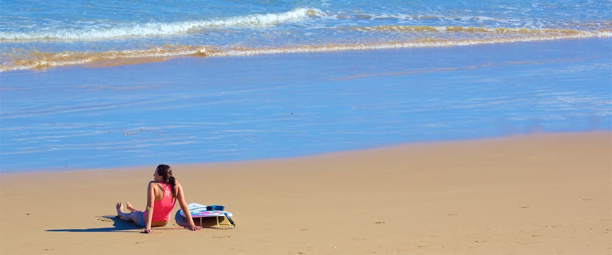 Great Ocean Road showing a sandy beach and general coastal views as well as an individual femail
