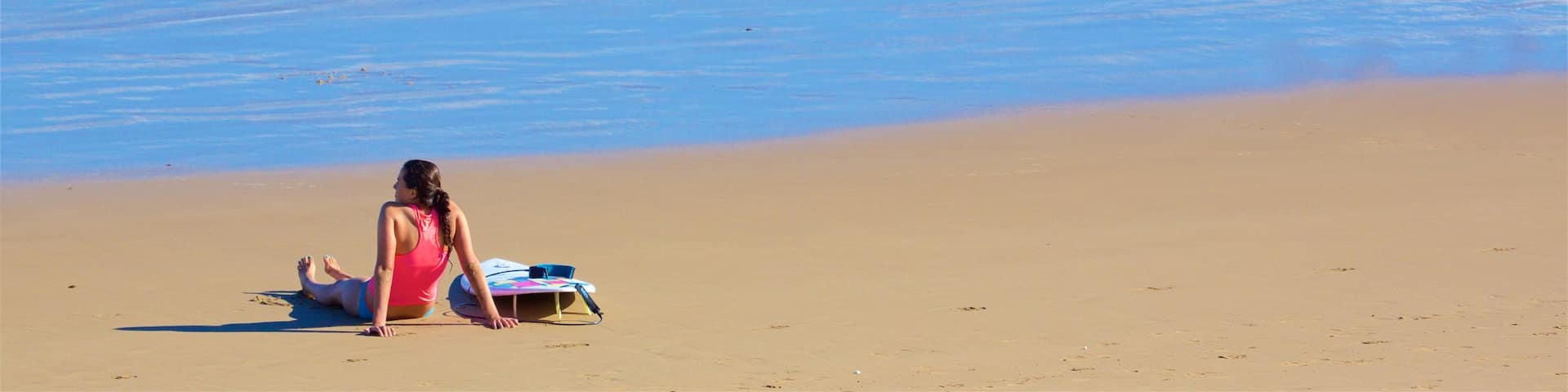Great Ocean Road showing a sandy beach and general coastal views as well as an individual femail
