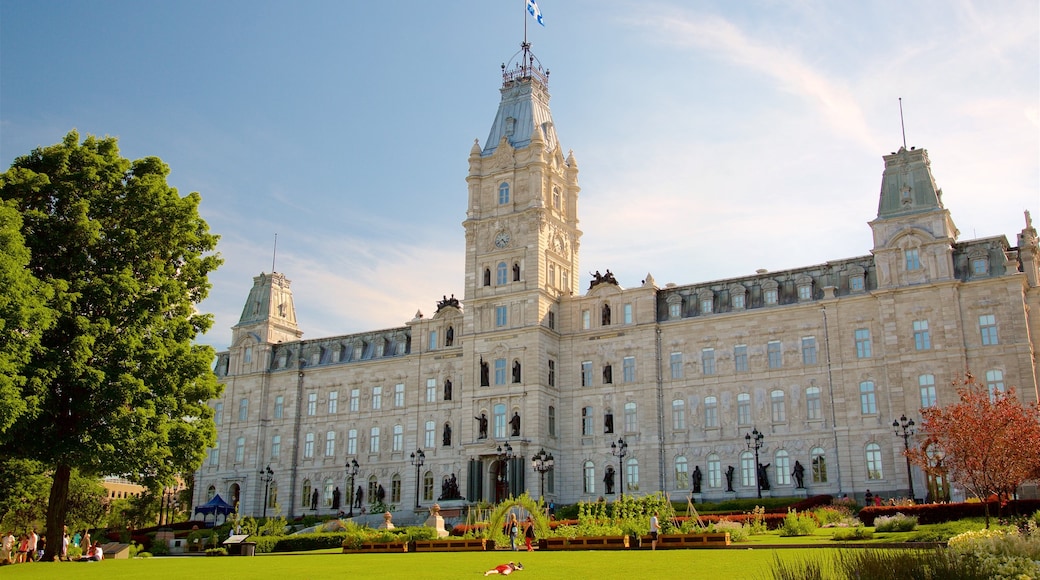 Parliament Building which includes a park, a sunset and heritage architecture