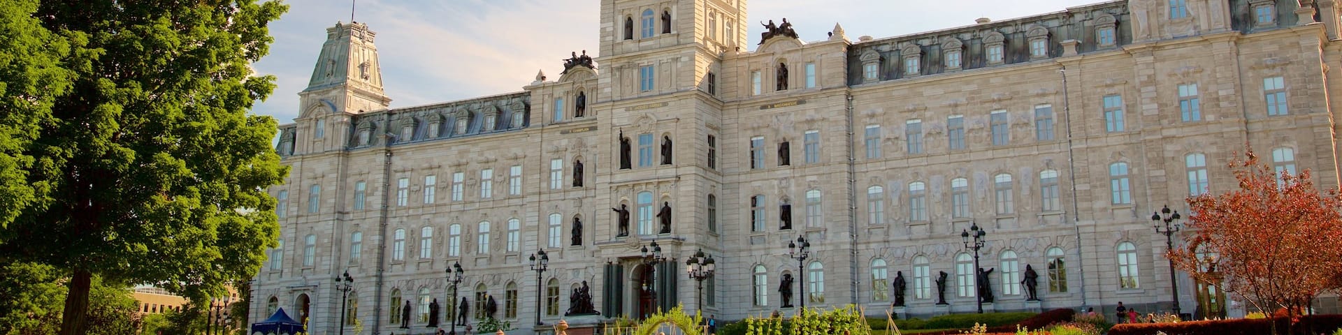 Parliament Building which includes a park, a sunset and heritage architecture
