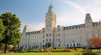 Parliament Building which includes heritage architecture, a garden and a sunset