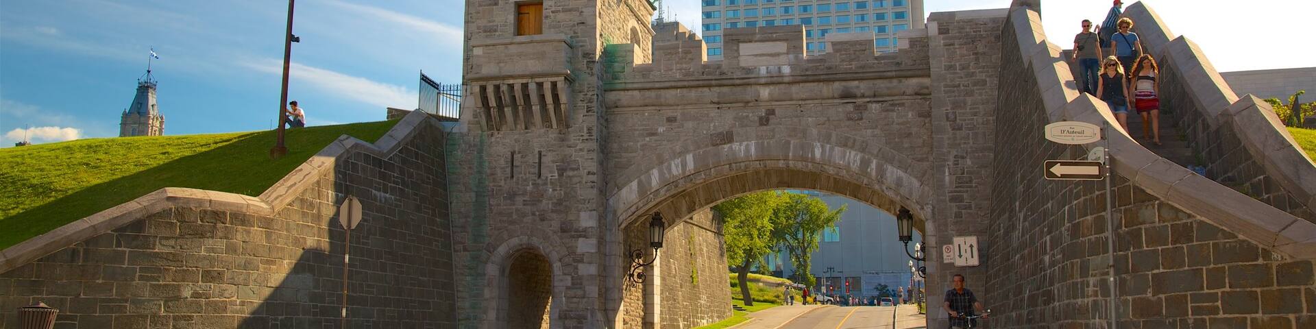 Parliament Building which includes a sunset, a bridge and heritage elements