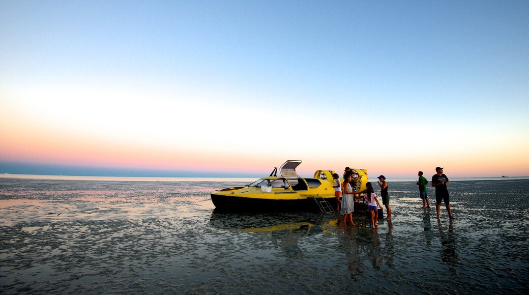 Broome which includes general coastal views and a sunset as well as a small group of people