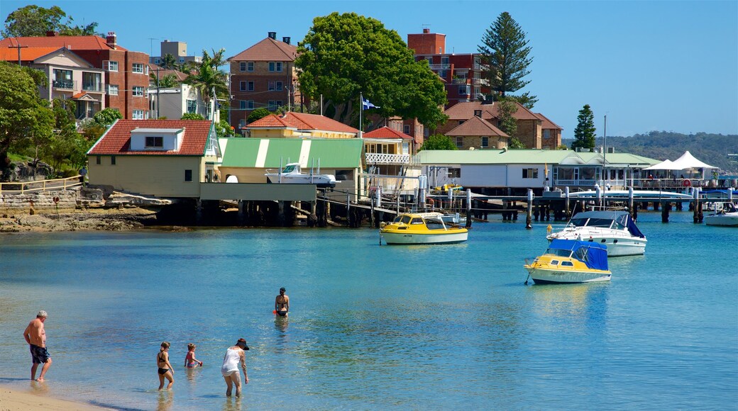 Manly montrant baie ou port, ville côtière et baignade