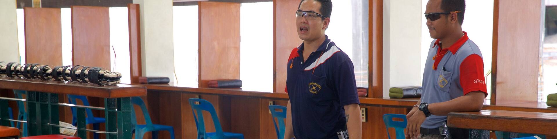 Phuket Shooting Range featuring interior views as well as an individual male