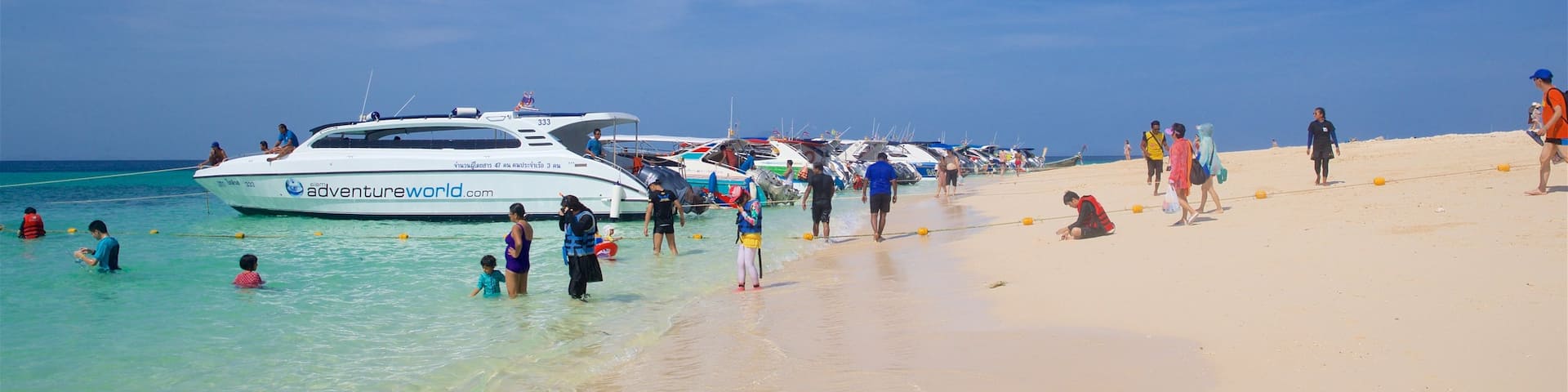 Bamboo Island which includes tropical scenes, boating and general coastal views