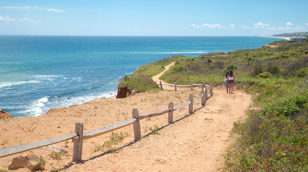 Shadmoor State Park showing general coastal views and a beach as well as a couple