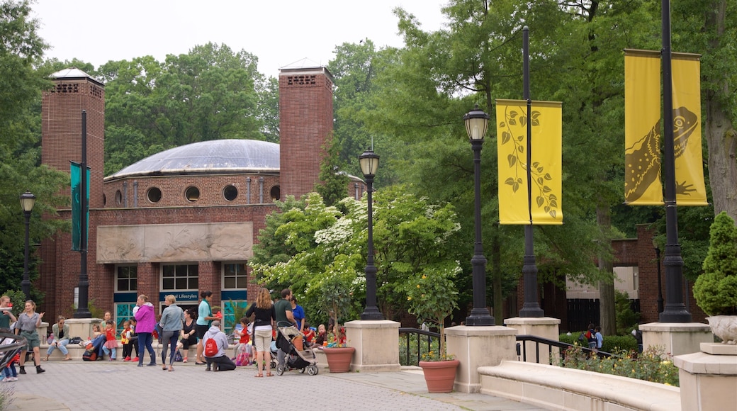 Prospect Park Zoo showing a garden as well as a small group of people