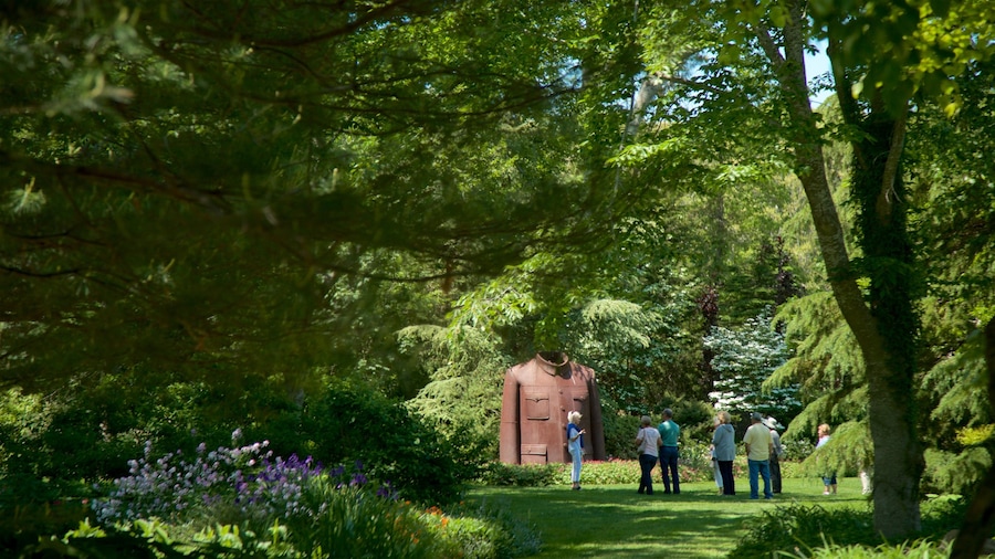 LongHouse Reserve featuring a park and outdoor art as well as a small group of people