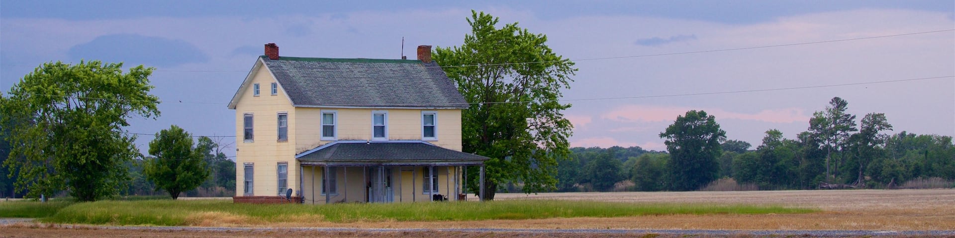 Cambridge showing a house, a sunset and farmland