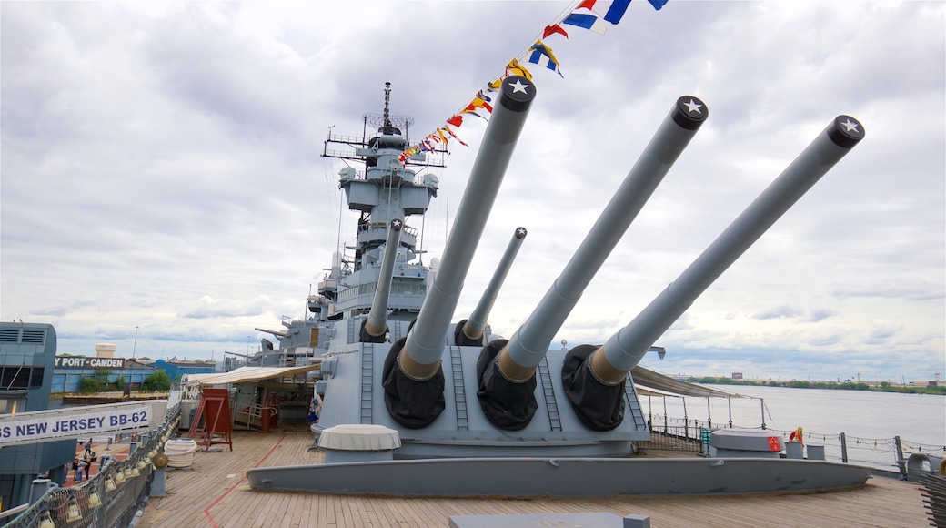 Battleship New Jersey showing military items and a marina