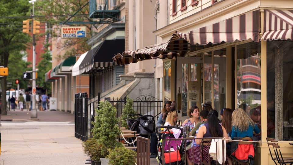 Downtown Jersey City showing outdoor eating as well as a small group of people
