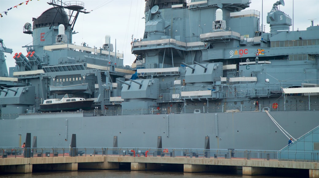 Battleship New Jersey showing a marina and military items