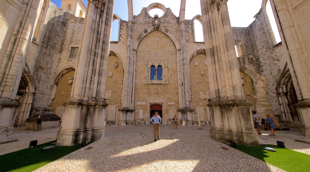 Carmo Convent showing heritage architecture and street scenes as well as an individual male