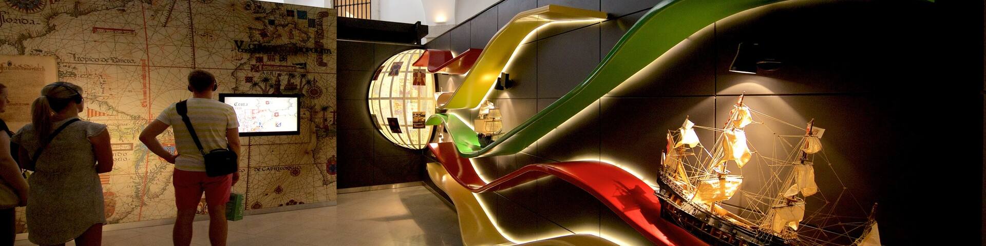 Lisboa Story Centre showing interior views as well as a small group of people