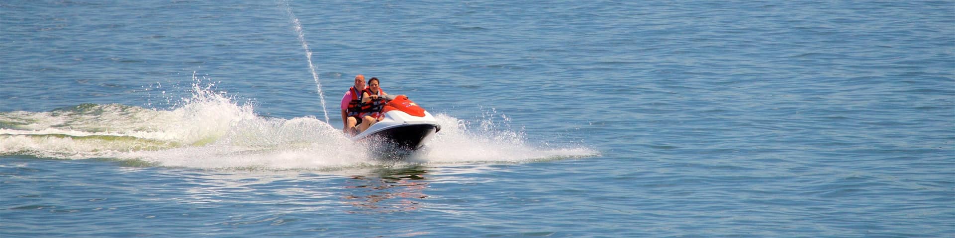 Table Rock Lake showing a lake or waterhole and jet skiing as well as a couple
