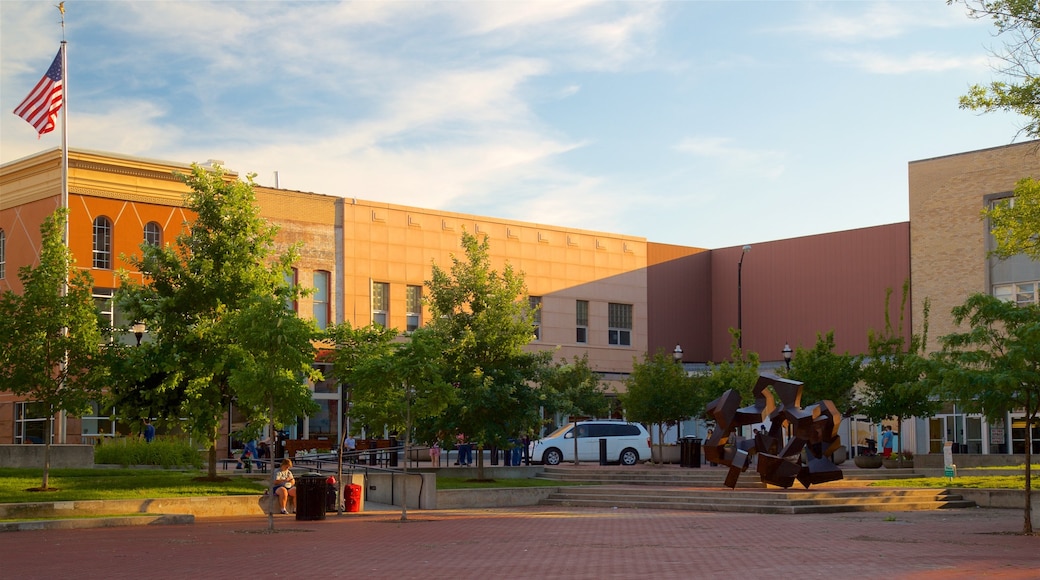 Springfield showing a garden, outdoor art and a sunset