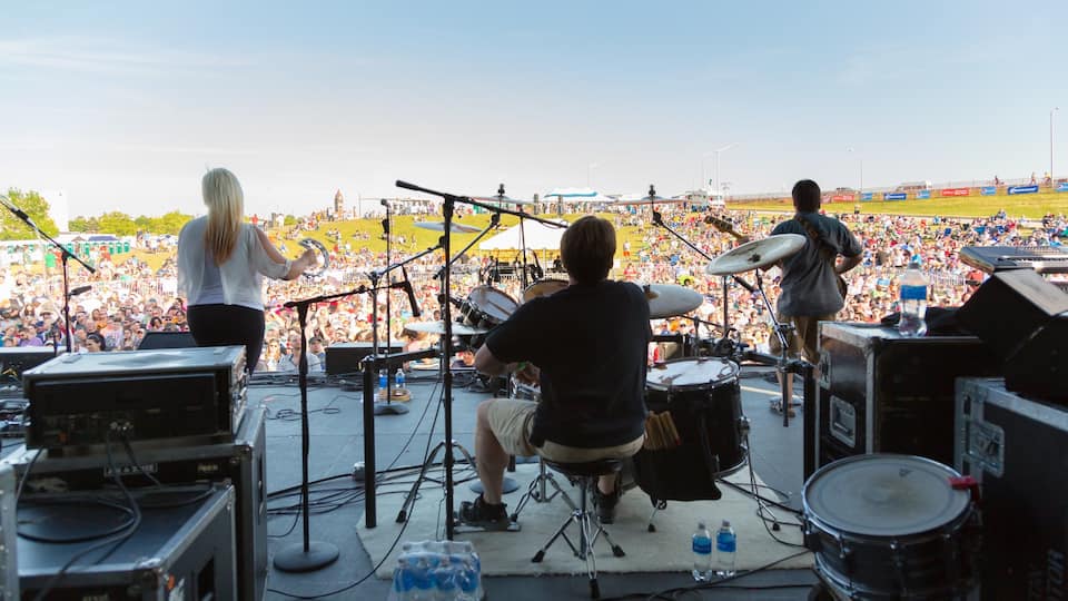 Saginaw which includes music and performance art as well as a small group of people