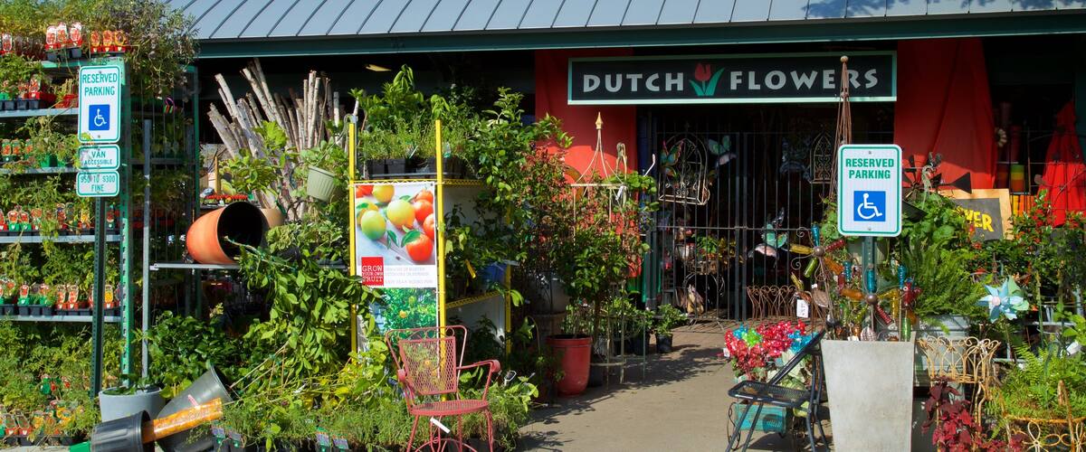 River Market featuring a garden, flowers and signage