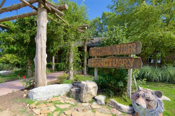 National Tiger Sanctuary showing signage and zoo animals